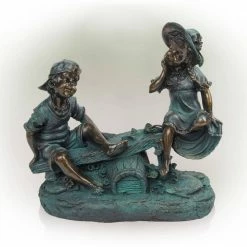 Alpine Corporation 14 in. Tall Indoor/Outdoor Girl and Boy Playing on Teeter Totter Statue Yard Art Decoration